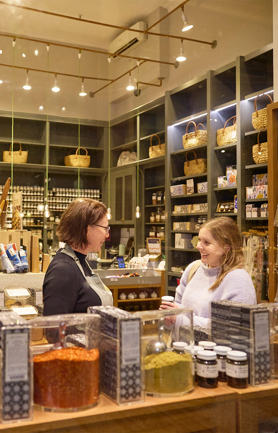 Spice Merchant serving a customer in store.