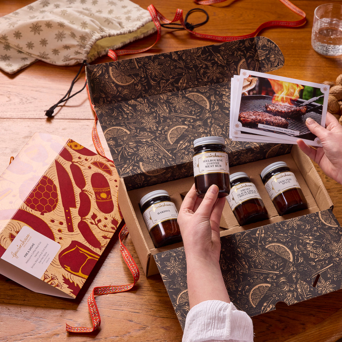 Gewürzhaus Fire & Smoke Gift Pack Lifestyle opening with jars and recipe cards