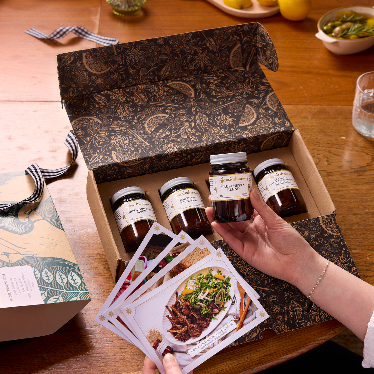 Gewürzhaus Mediterranean Table Gift Pack lifestyle opening with jars and recipe cards